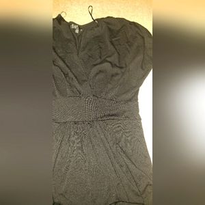 Black Dress Cute, mid thigh, deep V cut neck.